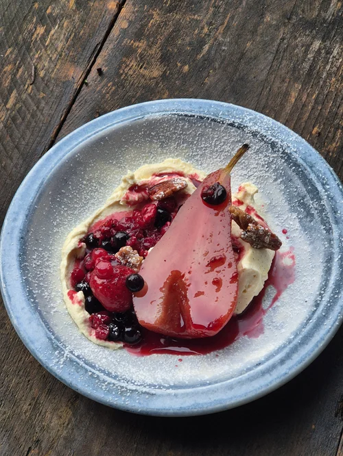 Poached pear with berries