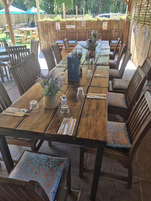 Long tables laid for a party in the Stable