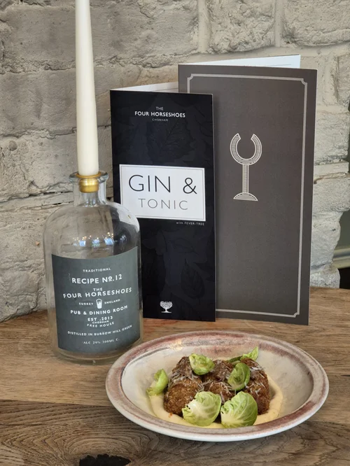 Our gin menu with a small plate
