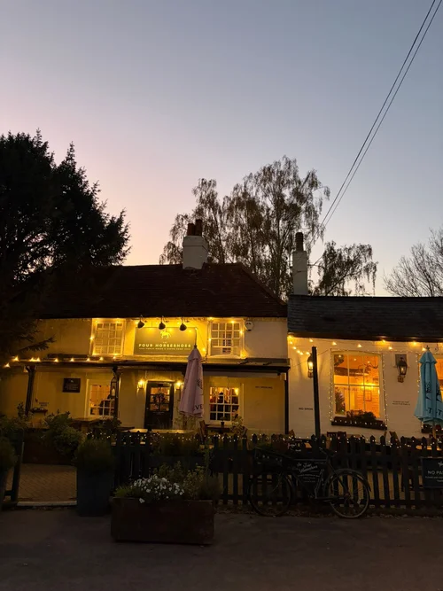 The pub lit up at dusk