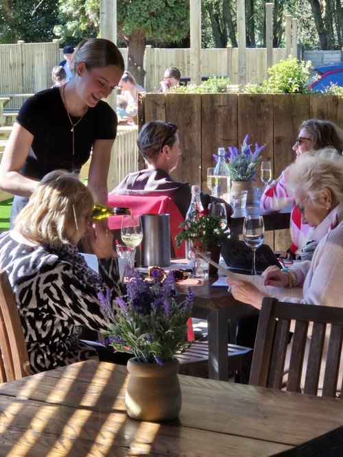Friends enjoying lunch on the terrace