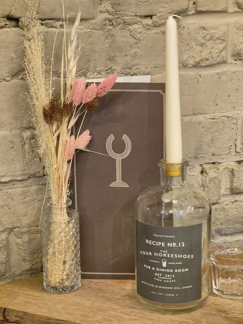 Dried flowers and a candle on the table