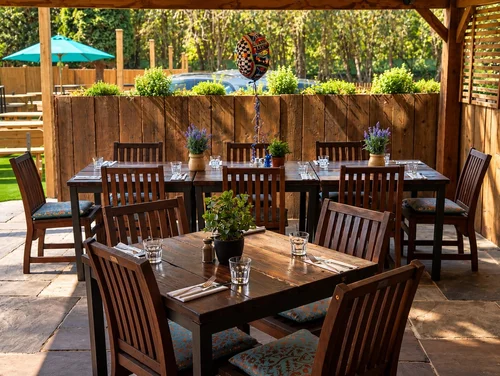 Tables laid on the covered terrace, ready for a party