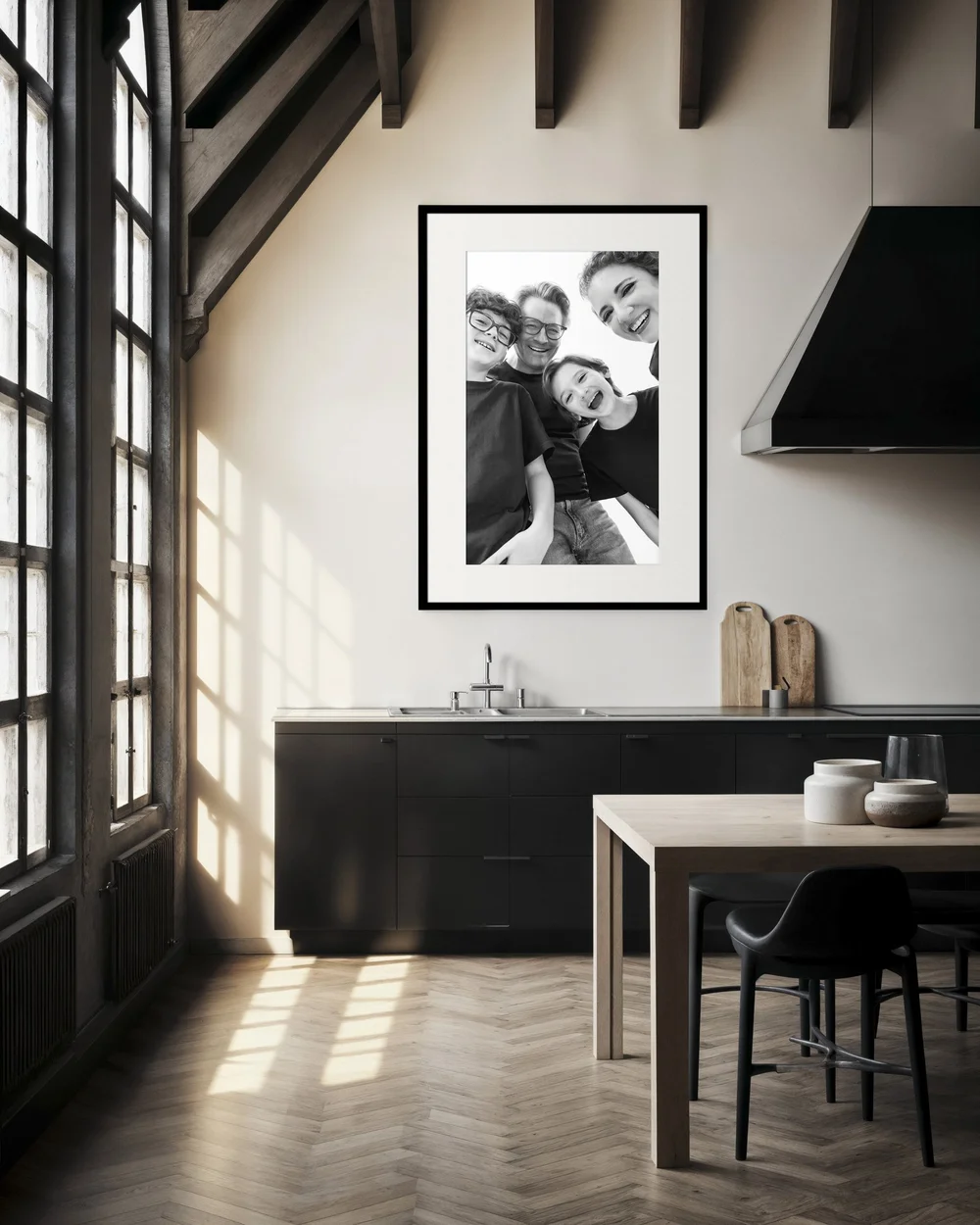 Black and white family portrait framed as wall art in a modern kitchen, Nicole Gates Photography McAllen Texas