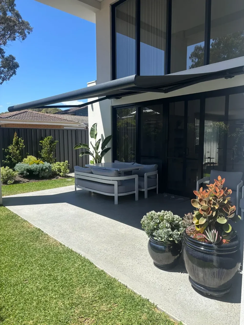 Retractable awning over a patio