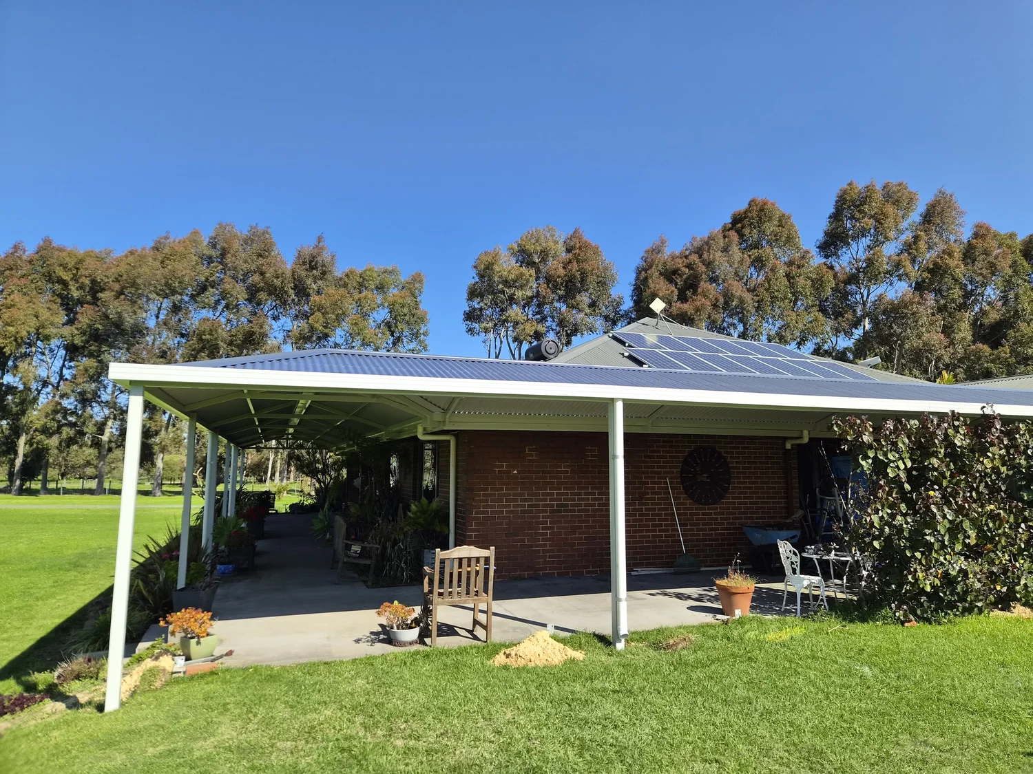 Hip roof verandah wrapping around a brick home
