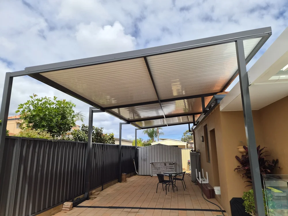 Flyover patio raised above the roofline of a rendered home
