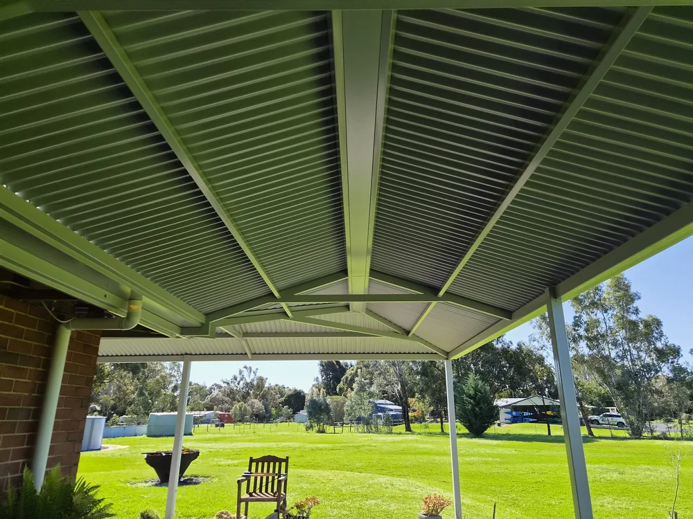 Underside of a hip roof patio showing the steel frame