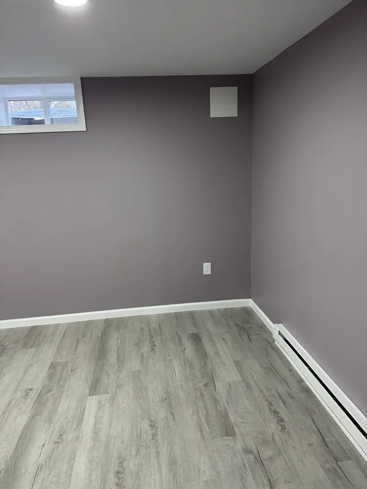 Bedroom with baseboard heat – North Wales, PA basement remodel