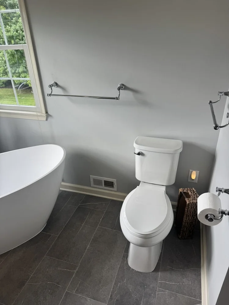 Toilet with charcoal matte tile floor – Hatfield, PA primary bathroom remodel