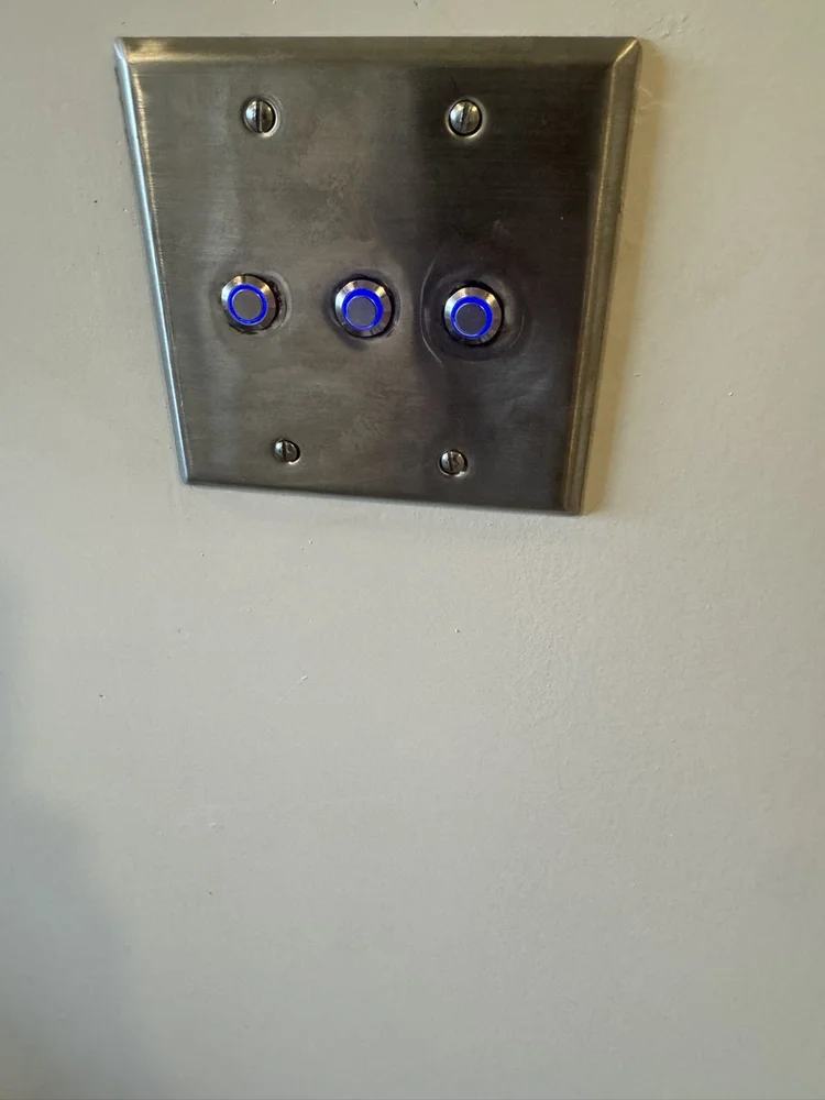 Three lit push buttons that open the hidden storage – Hilltown, PA attic playroom