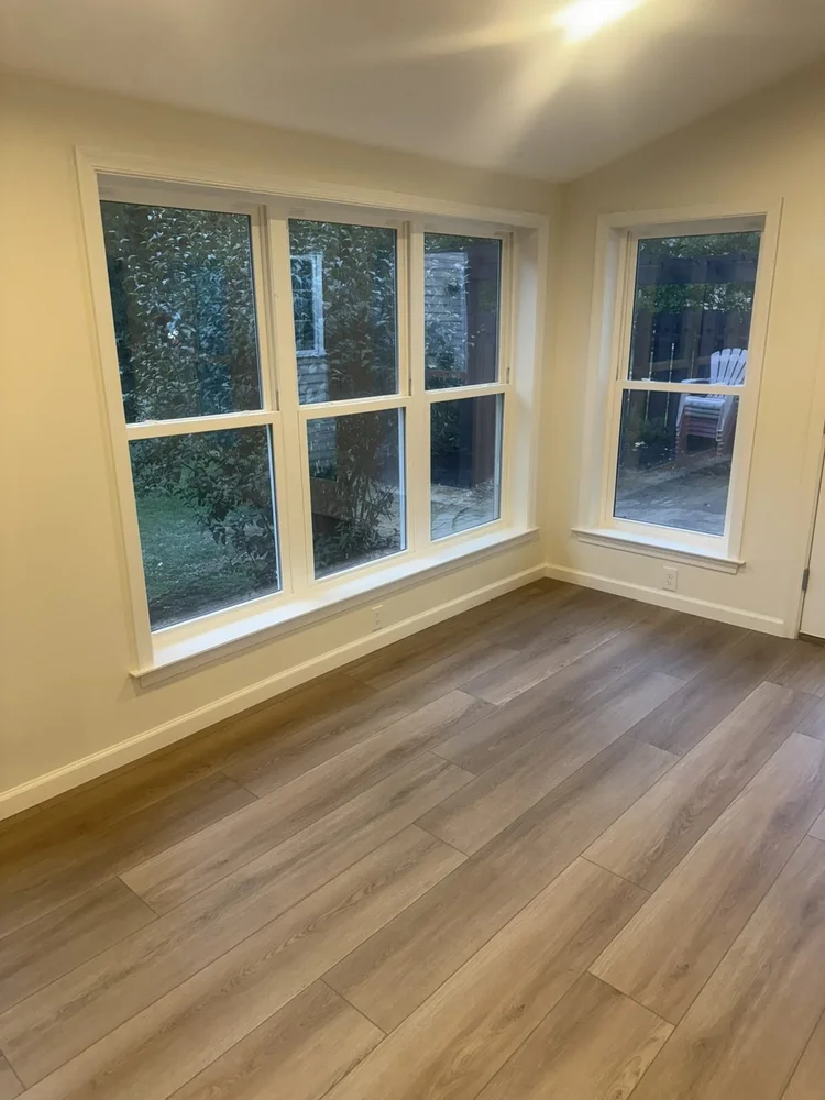 Corner windows with custom sills and Mohawk LVP flooring – Lower Macungie, PA four season room