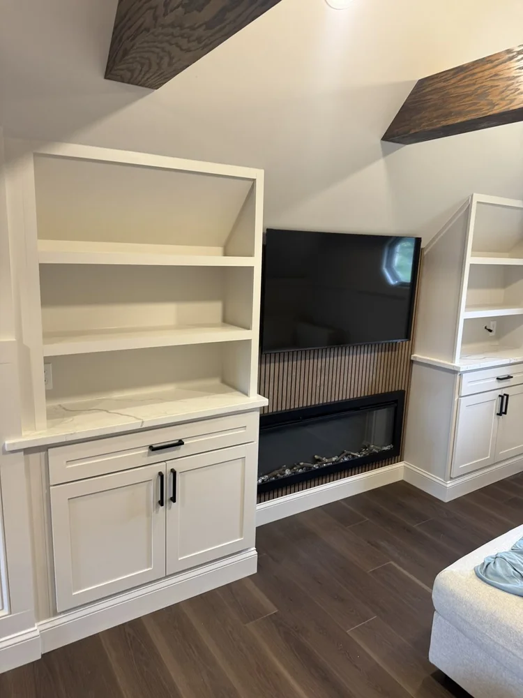 Custom built-in cabinets beside the fireplace – Hilltown, PA attic playroom