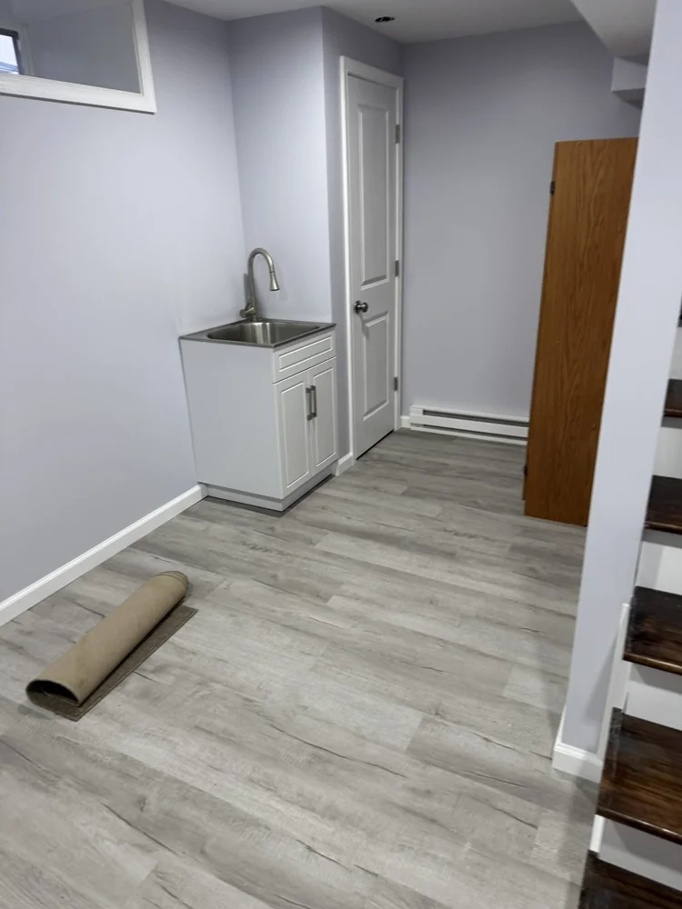 Laundry area with slop sink – North Wales, PA basement remodel