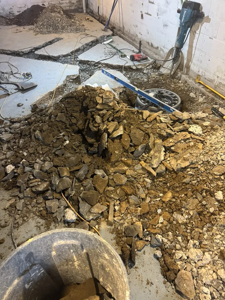 Basement floor cut open for the French drain – North Wales, PA basement remodel
