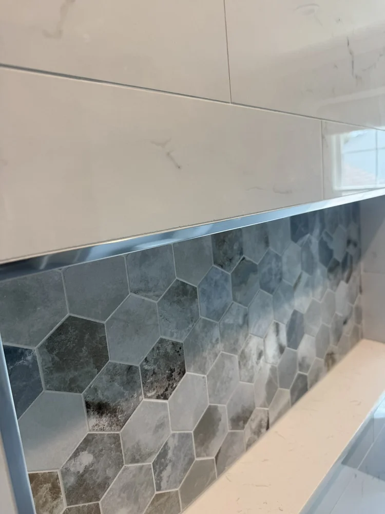 Close-up of the shower niche trim and accent tile – Hatfield, PA primary bathroom remodel