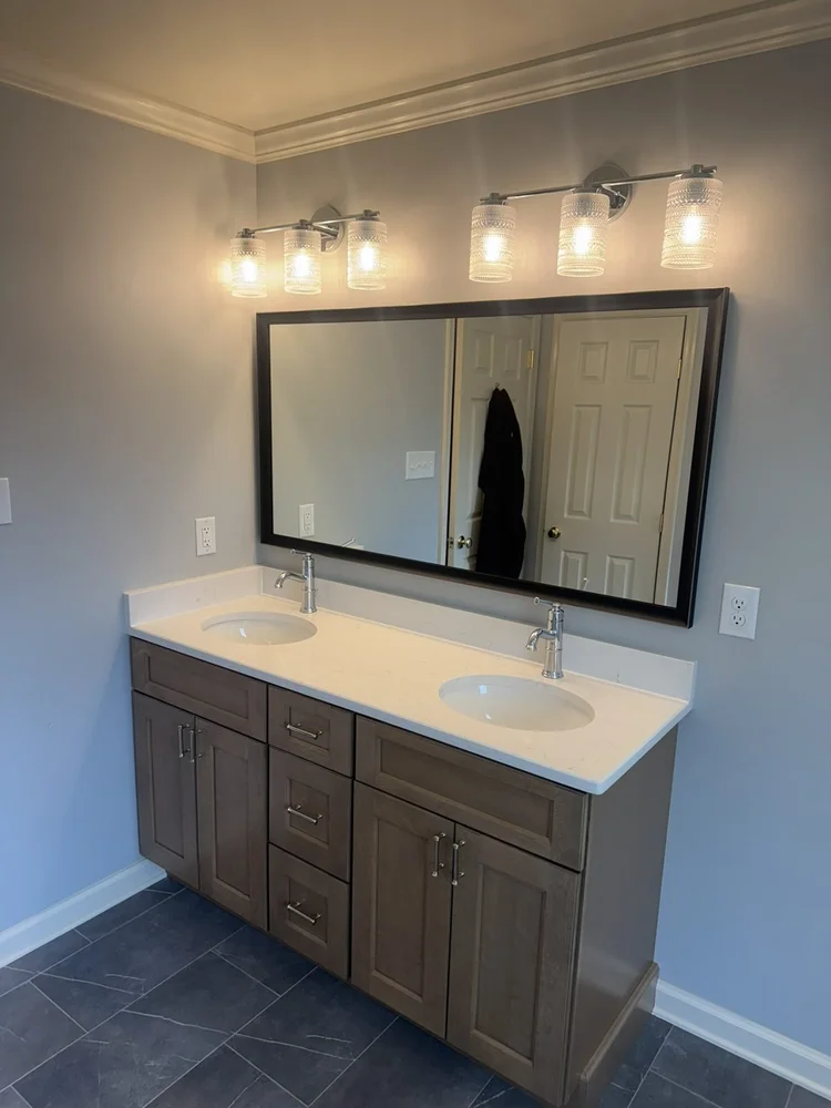 Double vanity with two 3-light vanity fixtures – Hatfield, PA primary bathroom remodel