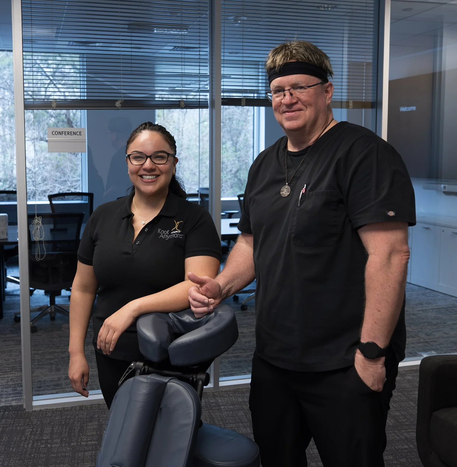 Knot Anymore massage therapist giving a chair massage at an Austin workplace