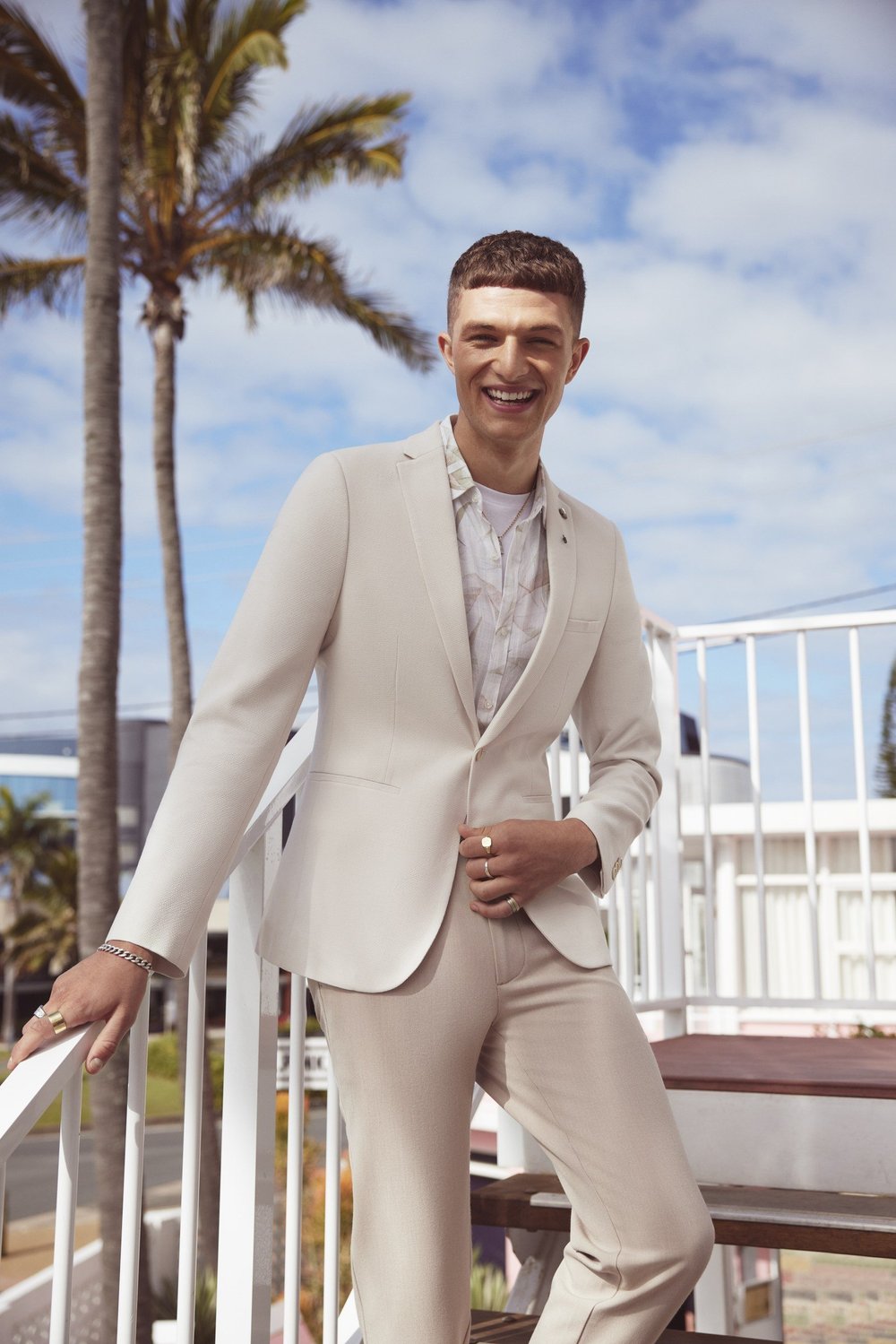 YD Spring Refresh model in a cream suit on the Pink Hotel rooftop
