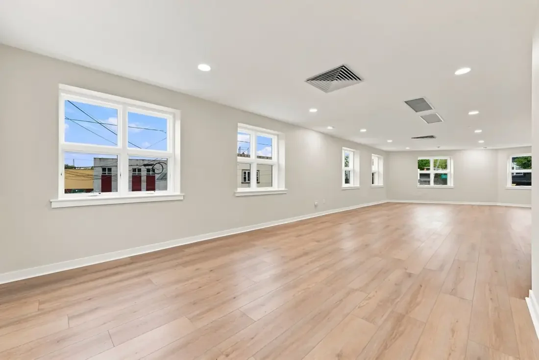 The upstairs event room, lined with windows