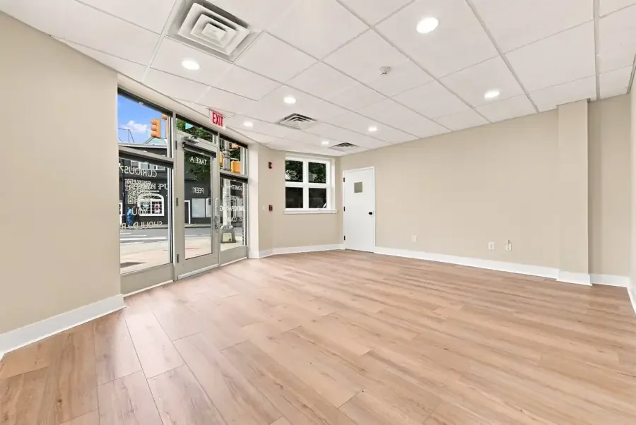Street-level lobby with storefront windows