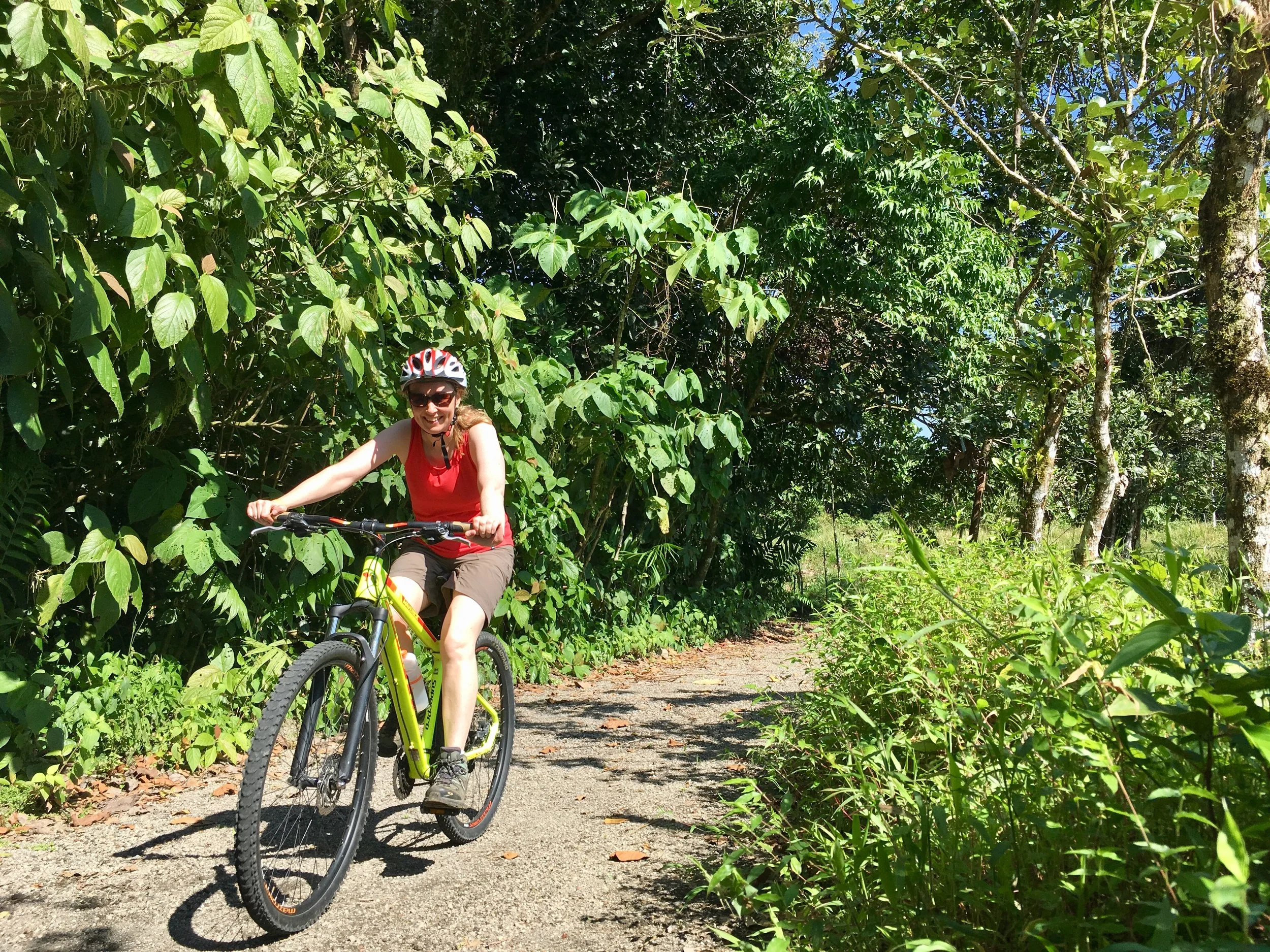 Andrea guiding mountain biking on jungle trails in Costa Rica