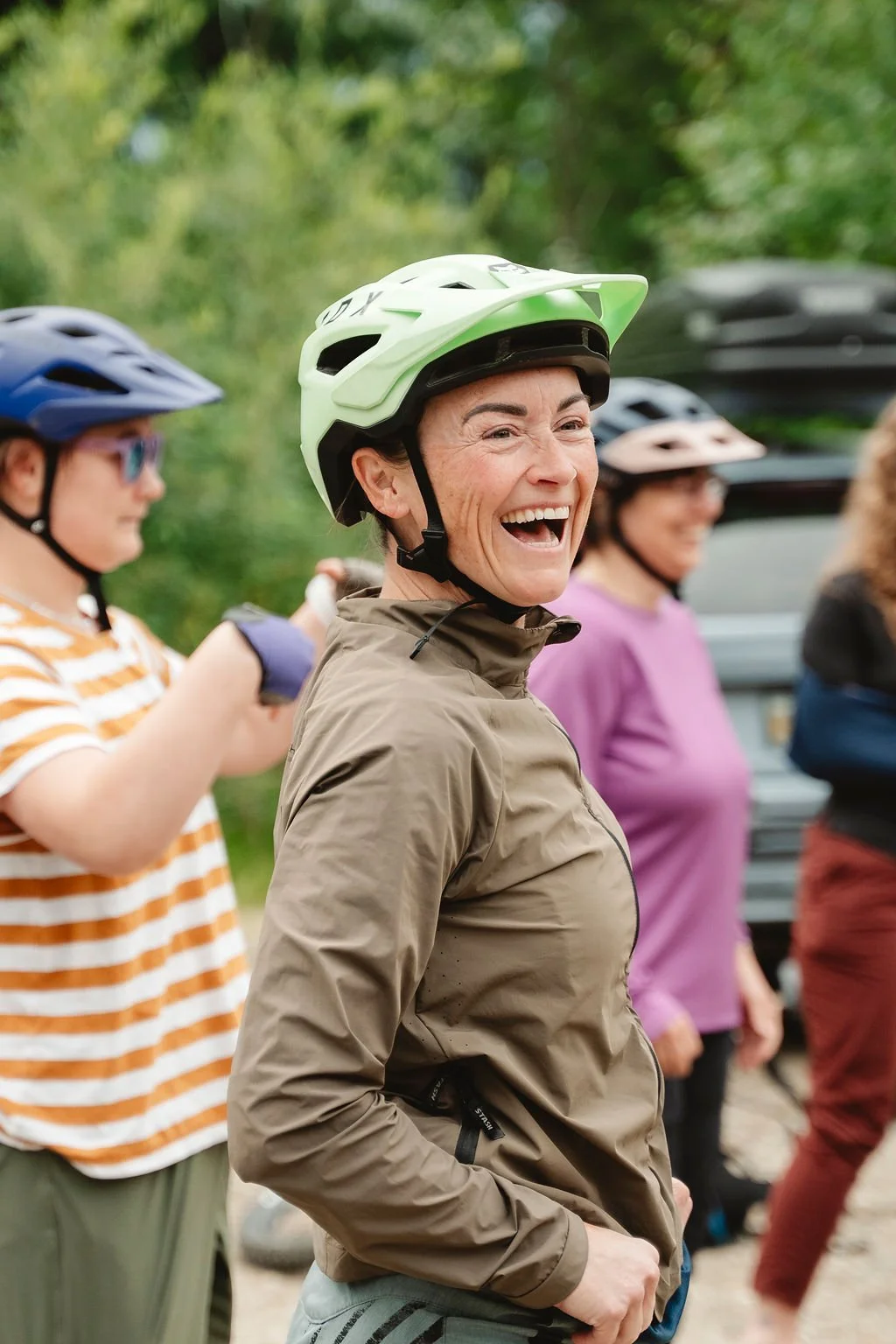 Women laughing at the bottom of a run