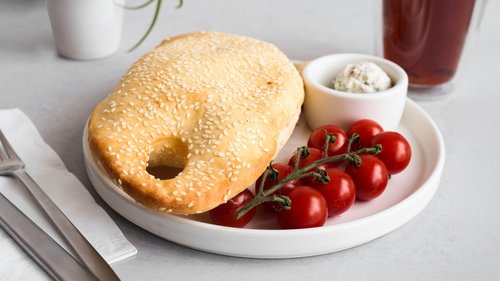 Purse bread with herb walnut feta and cherry tomatoes on a plate