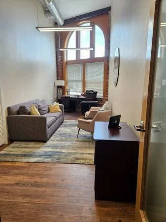 Therapist office for rent East Liberty Pittsburgh with sofa and desk