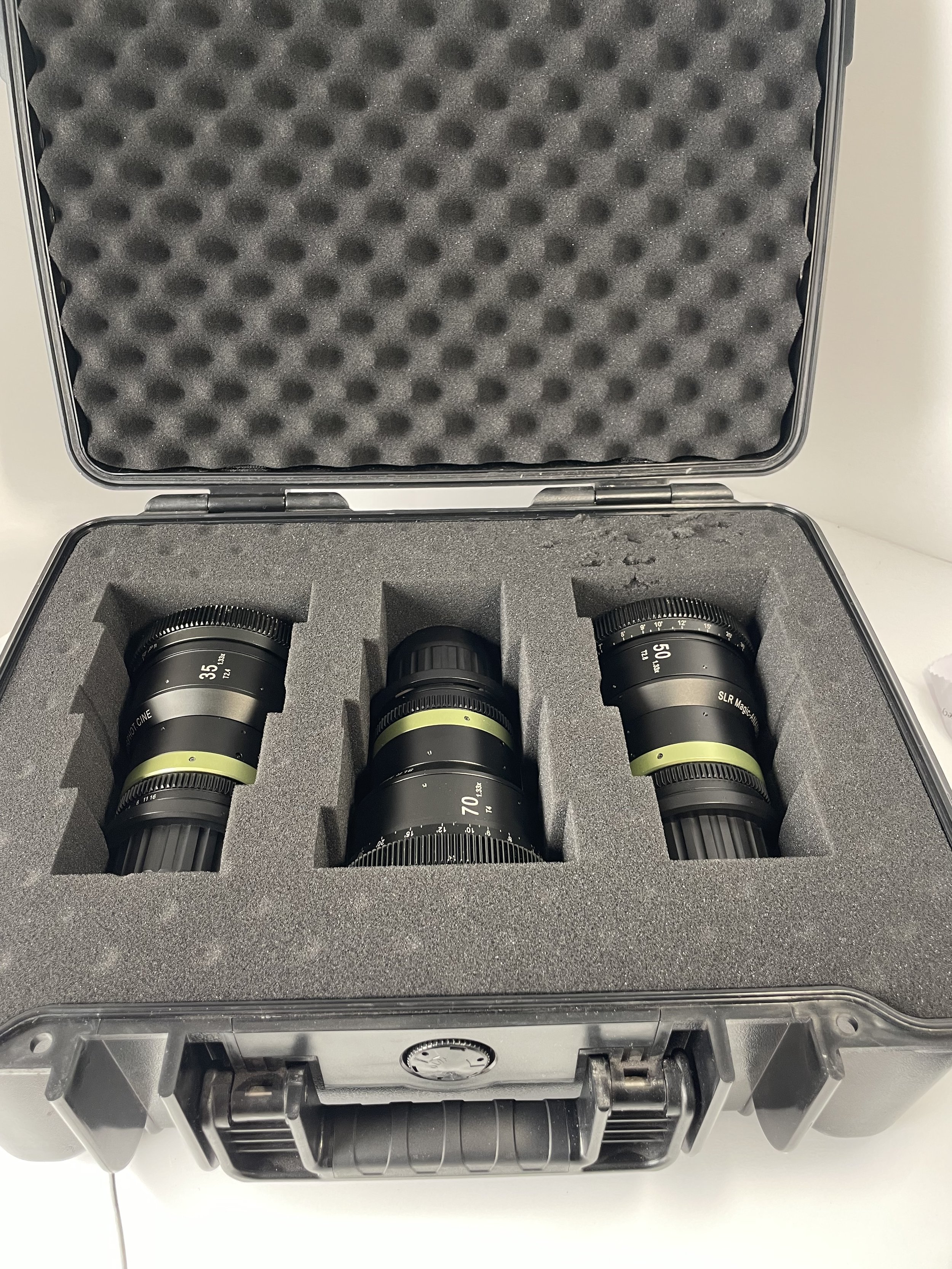 SLR Magic three-lens set shown in its case. Confirm included accessories.