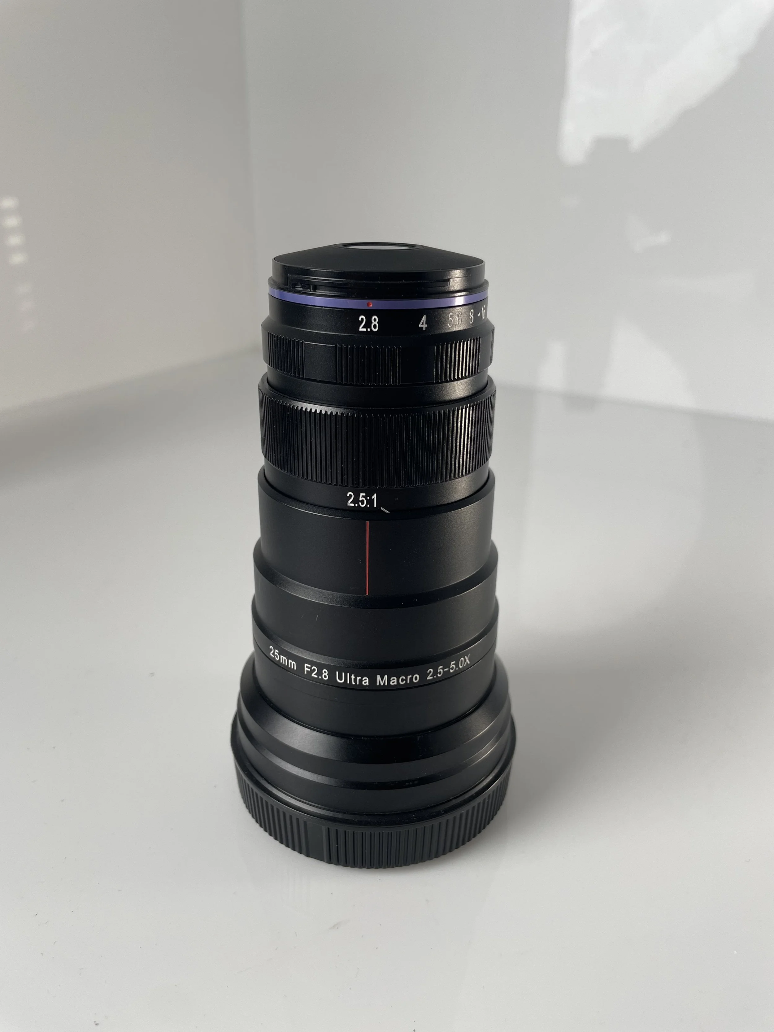 Laowa 25mm f/2.8 Ultra Macro 2.5–5×, retracted barrel.