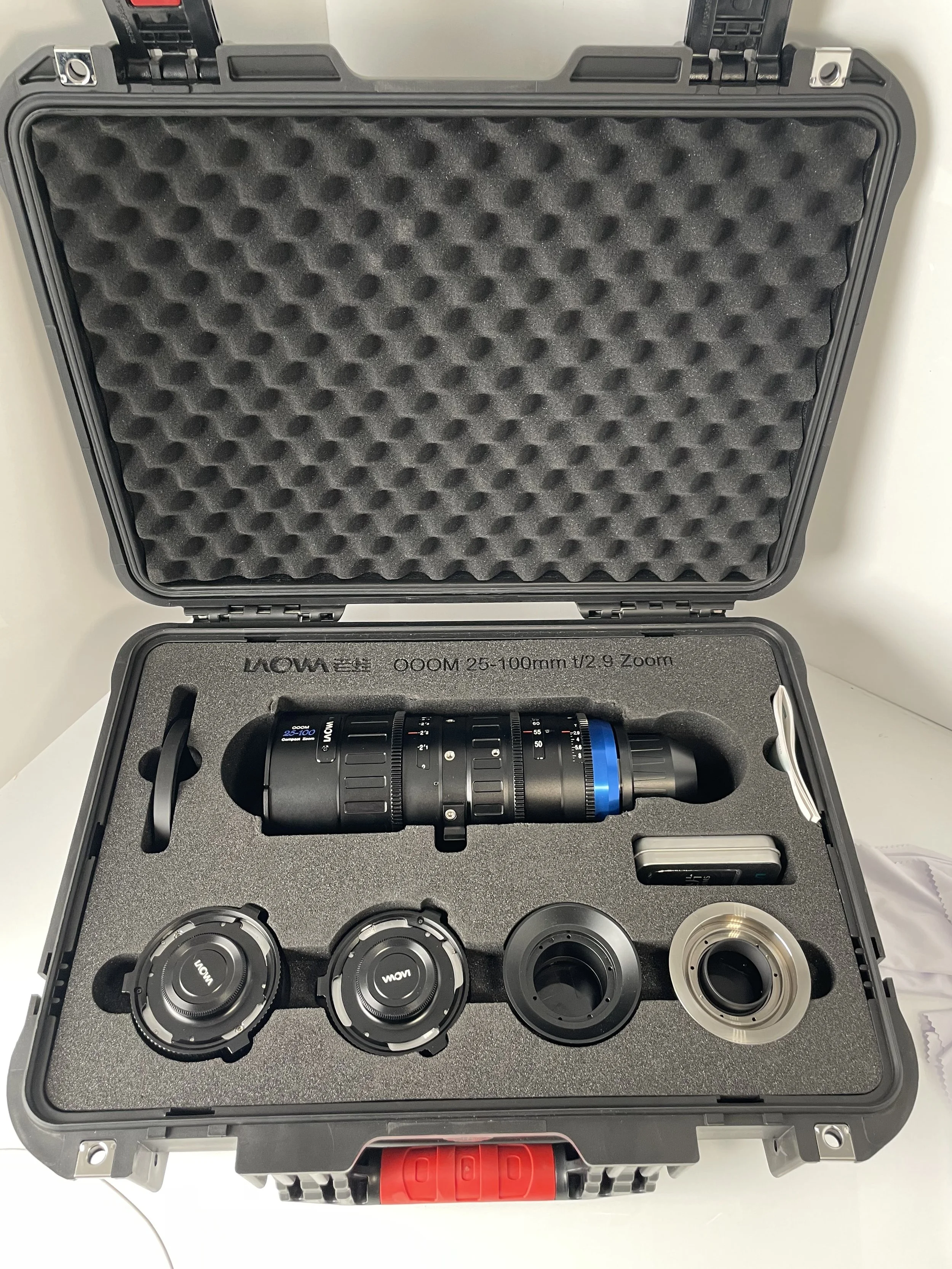 Laowa OOOM lens and case. Both the full-frame and rear anamorphic expanders are included in this package.