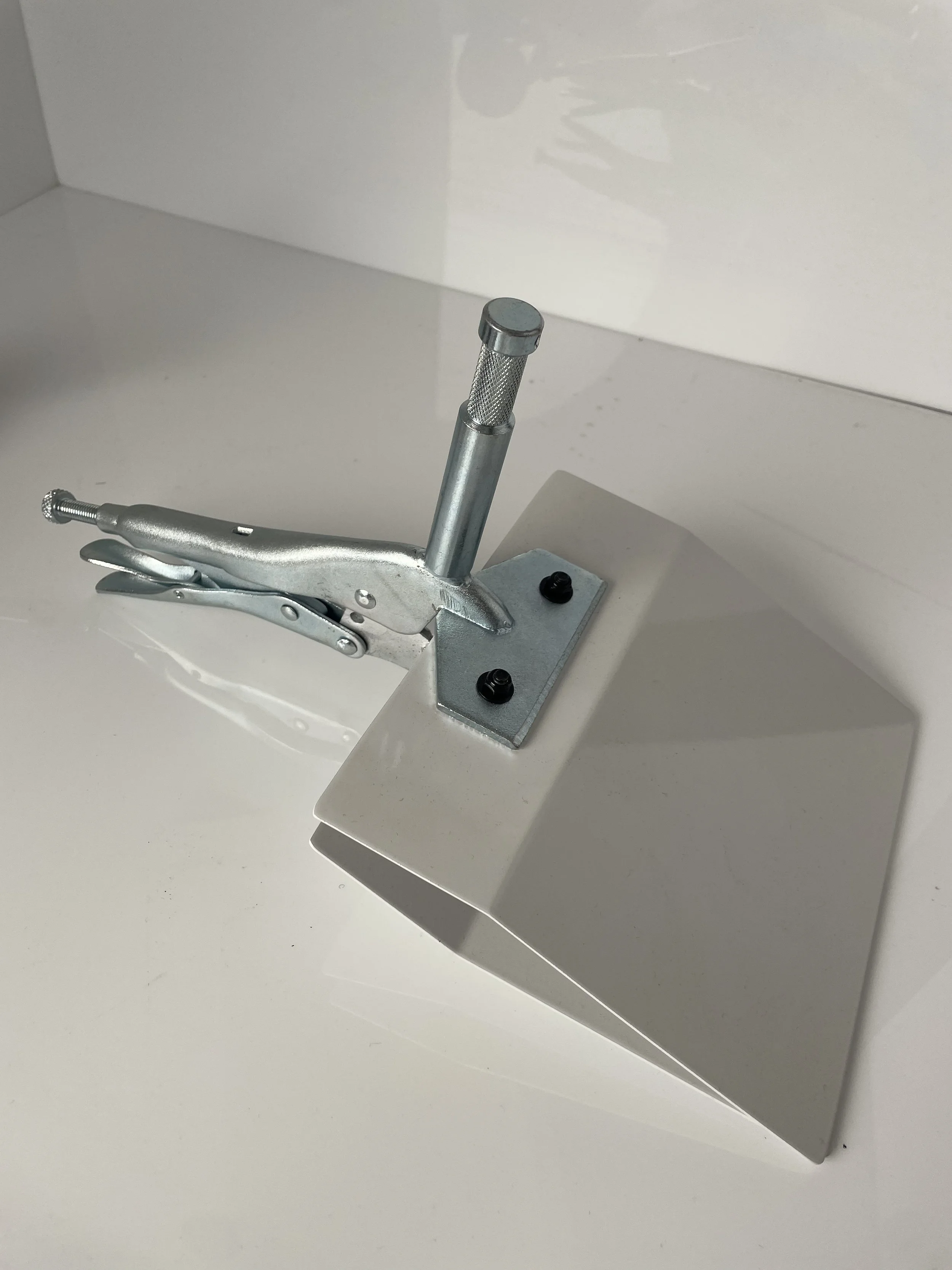 Duckbill clamp / beadboard holder; confirm included parts with Marcus.