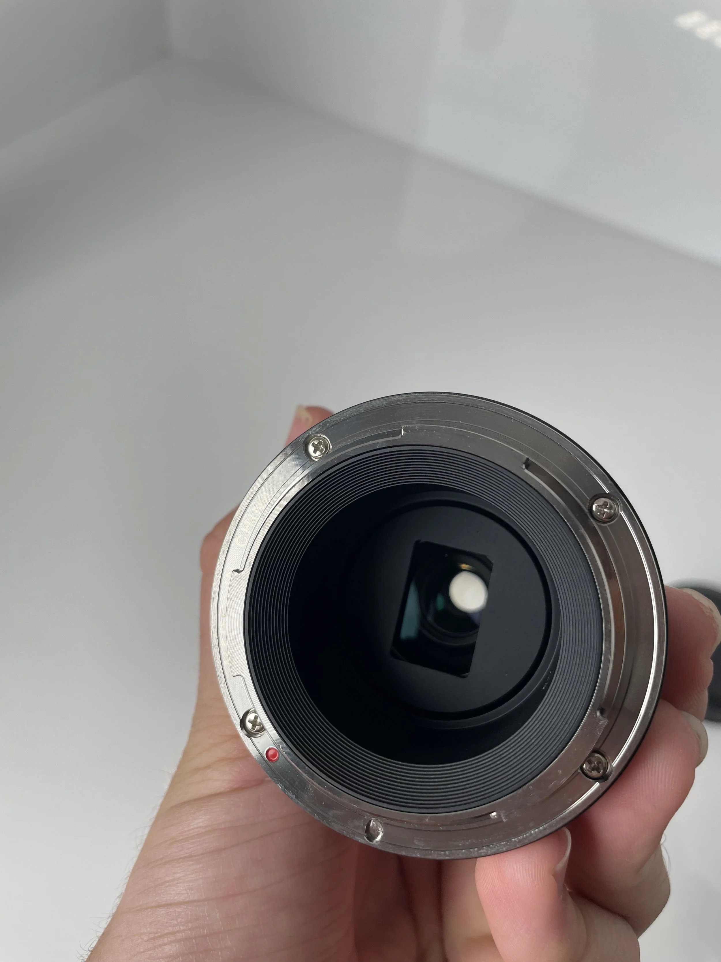 Laowa 25mm ultra macro, rear mount. Compatibility to confirm.