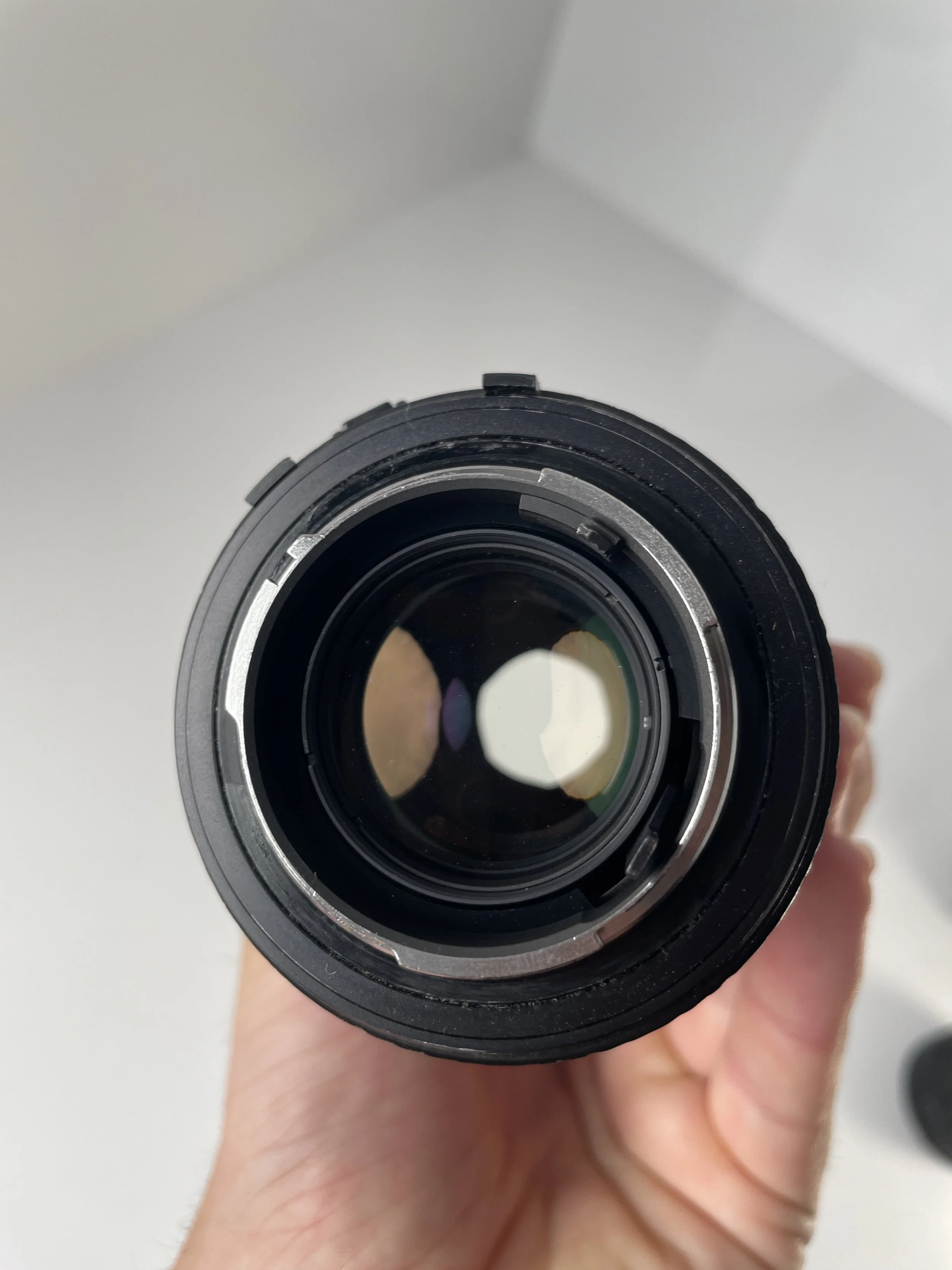 Minolta 75–200mm, rear mount and element.