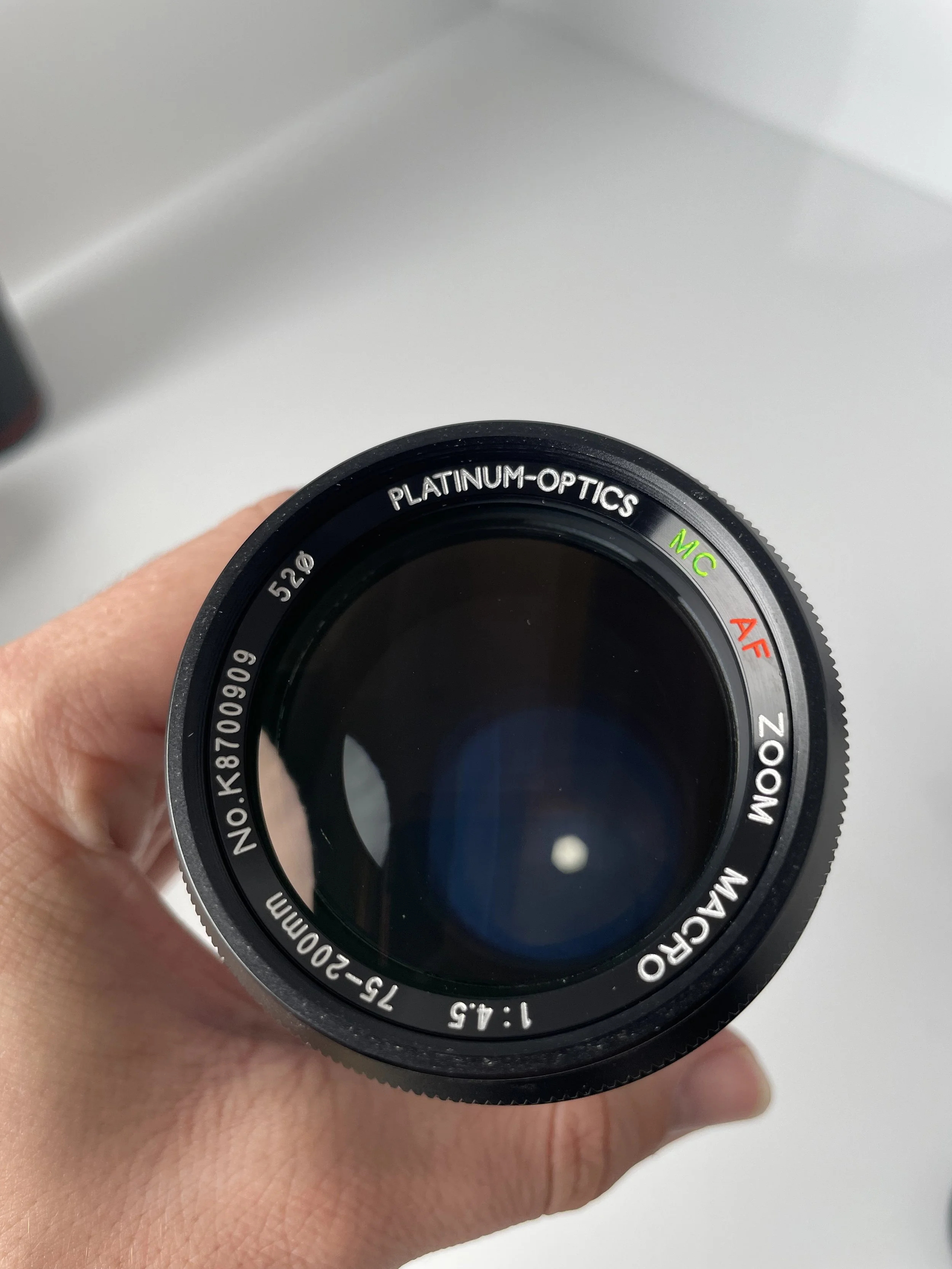 Platinum Optics MC AF 75–200mm f/4.5 Macro, front view.
