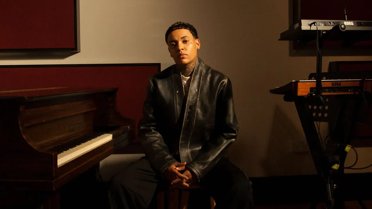 KWN in a music room beside a grand piano