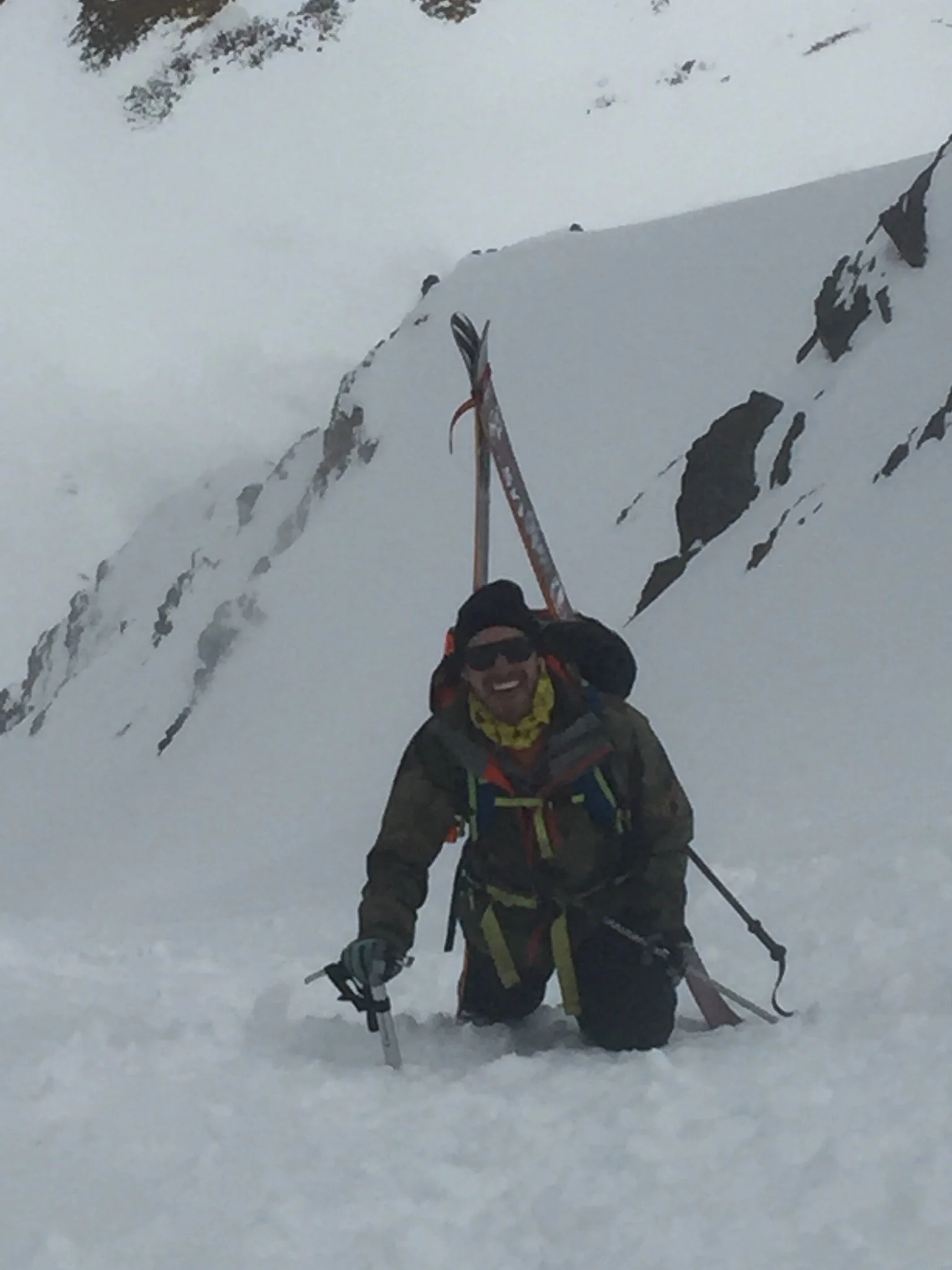 Nick bootpacking with skis on his pack