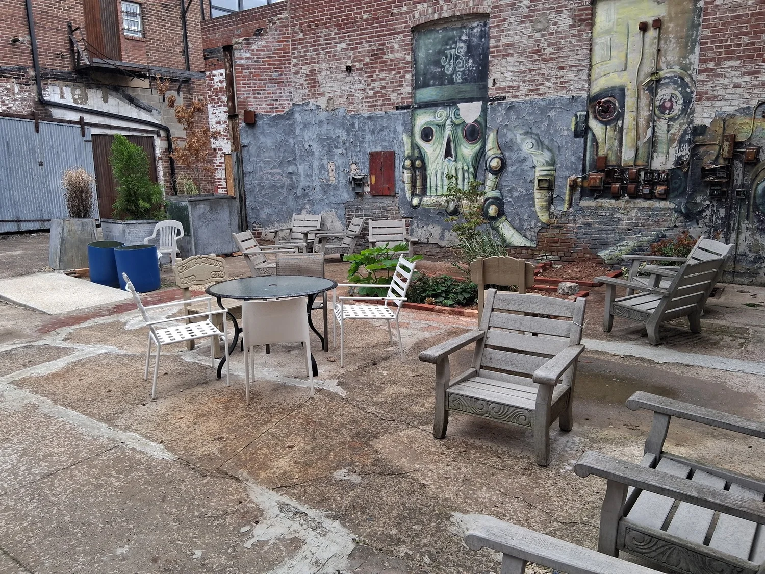 Outdoor seating, tables and planters in the private courtyard at D Street Studios, Philadelphia