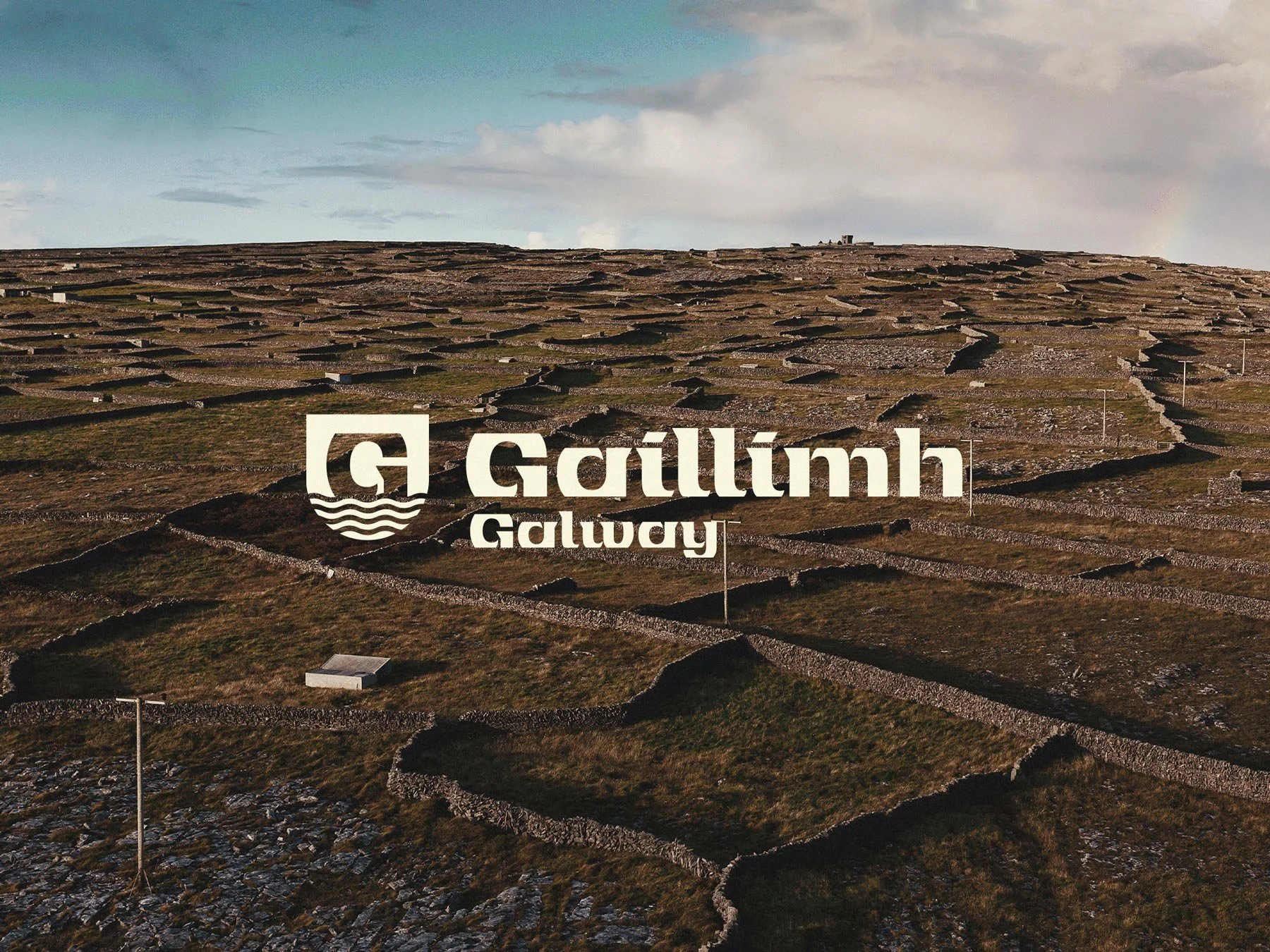 Galway tourism logo, over background images of fields