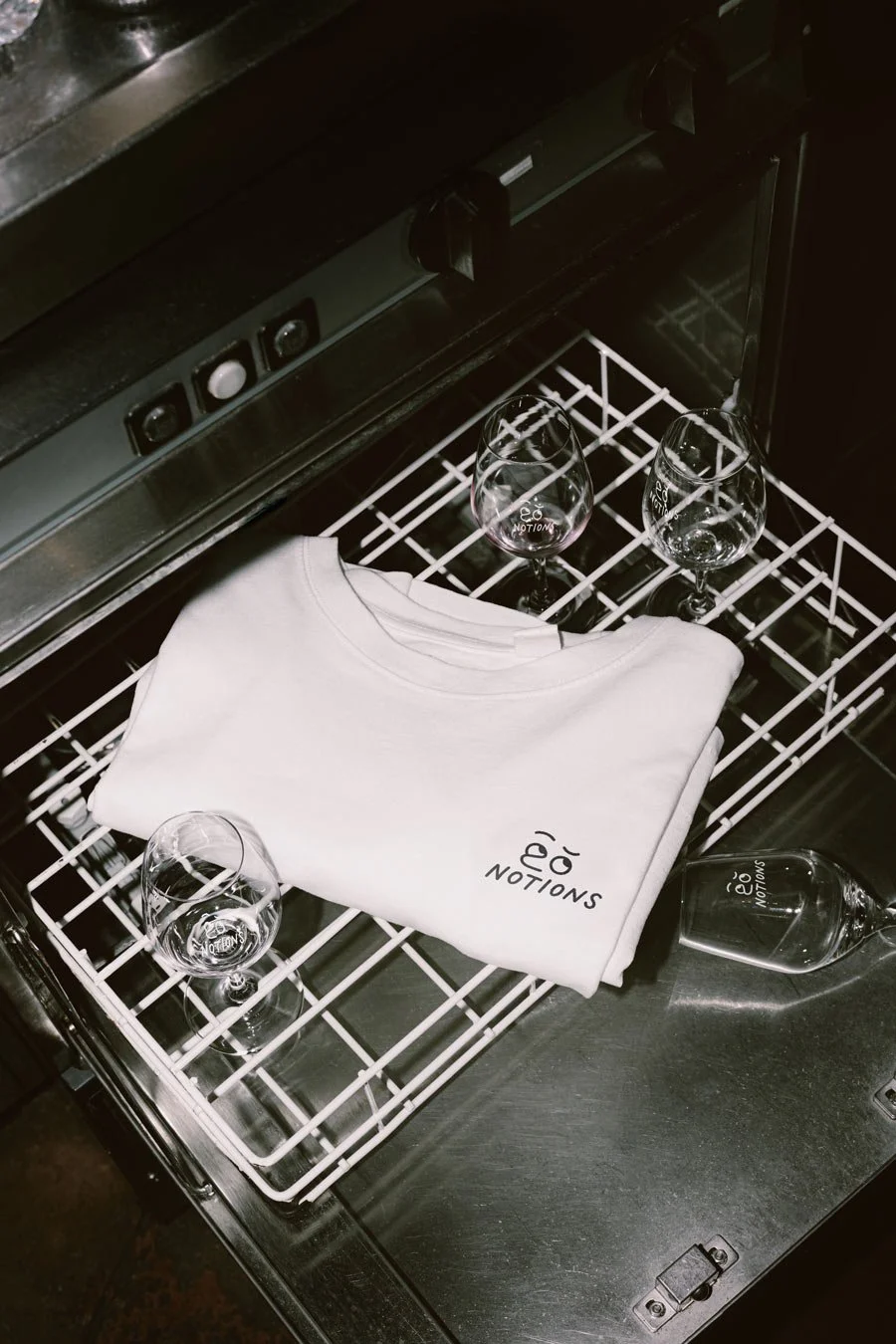 Notions wine bar, t-shirt on top of a dishwasher