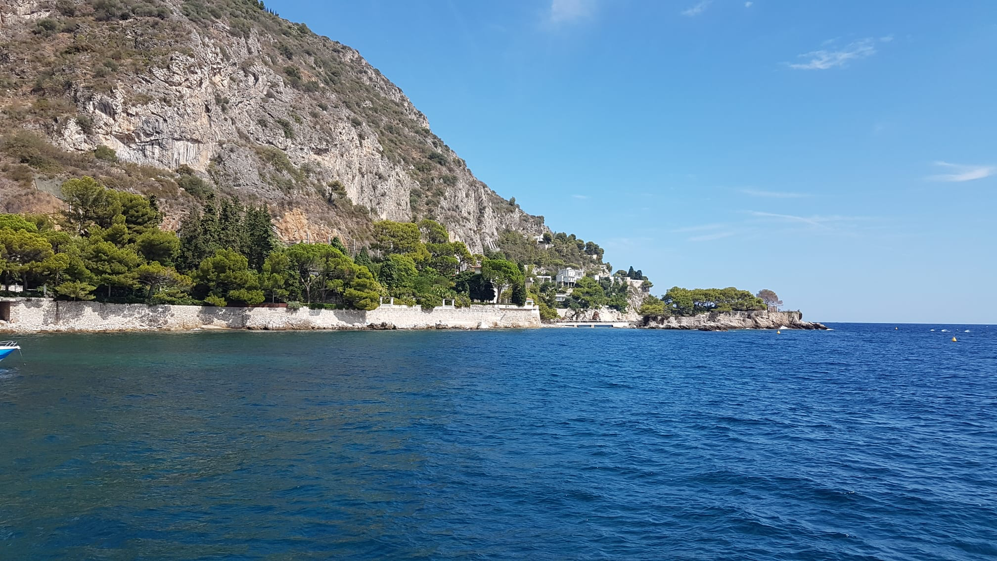 French Riviera villas and a rocky islet beside the Mediterranean