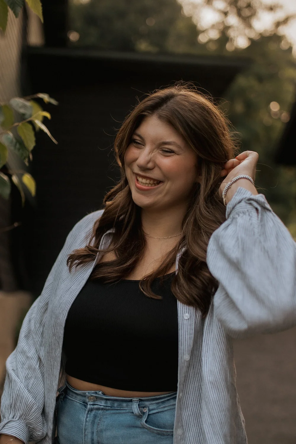 Clarkson student laughing during an evening portrait session