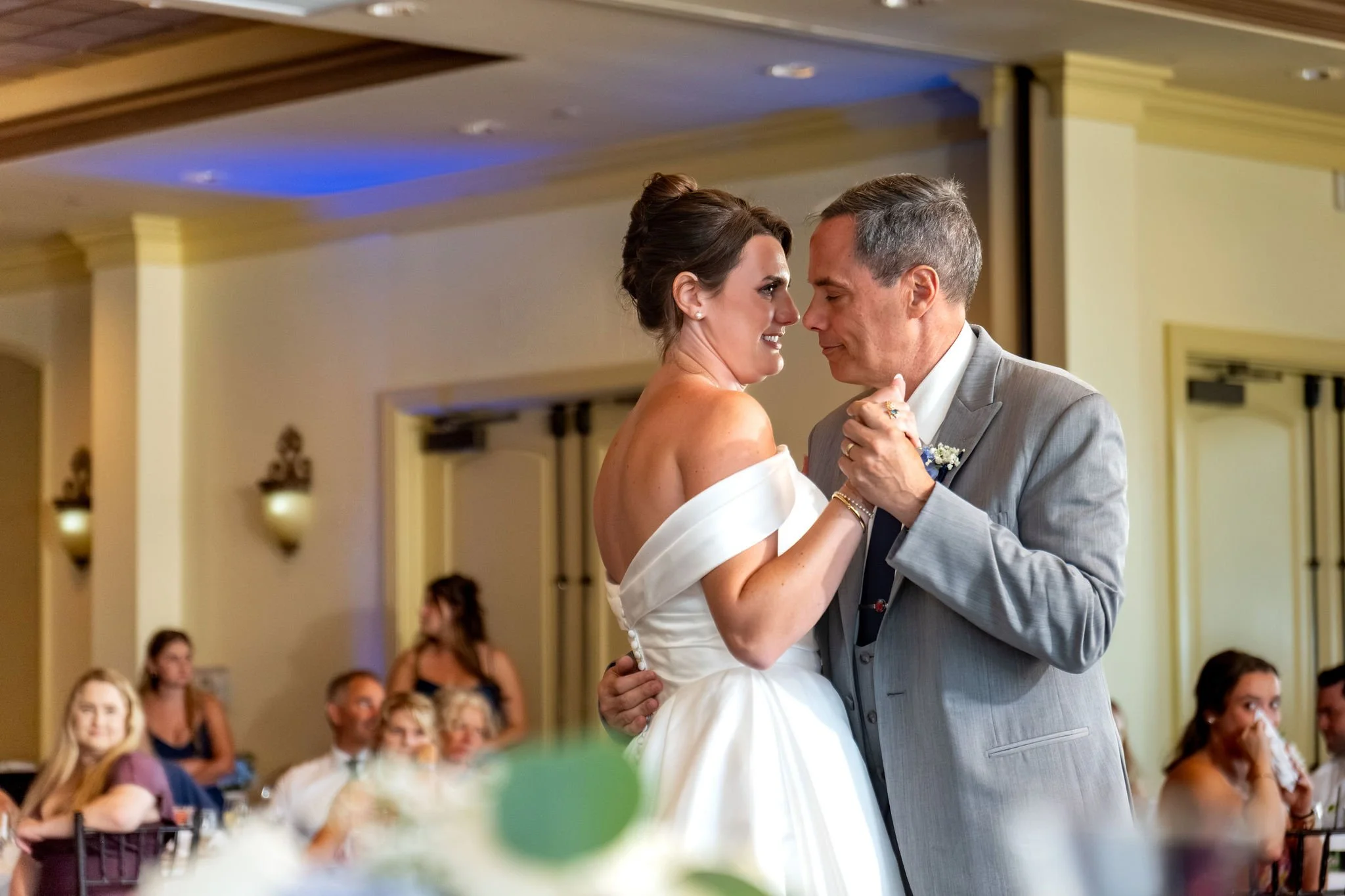 Caroline Pirolli dancing forehead to forehead with her father under the ballroom uplight at Union Bluff Hotel in York Maine wedding photography VMG Productions