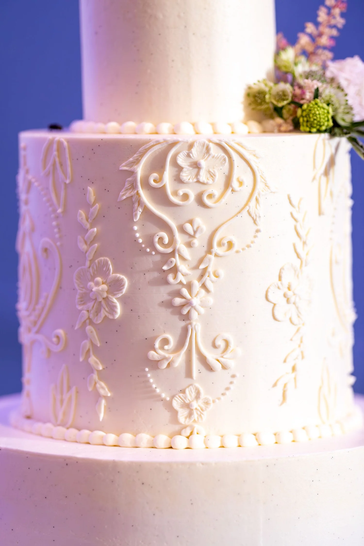 Piped lace and floral detail on Nicole and Alexey's wedding cake at Portland Sheraton at Sable Oaks South Portland Maine summer wedding photography VMG Productions
