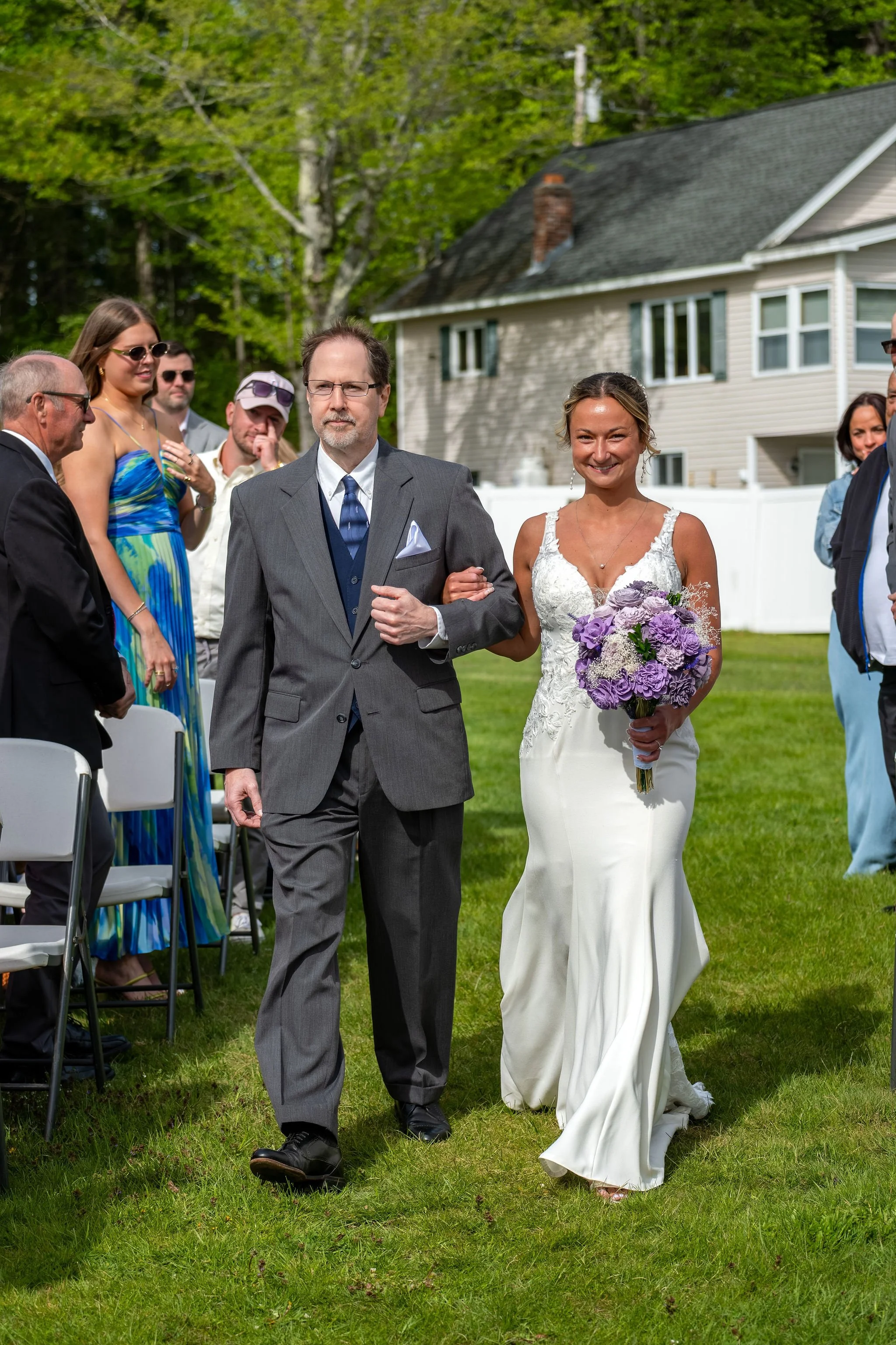 Beth and Cameron bride walking down the aisle with her father at Augusta Country Club Manchester Maine spring wedding photography VMG Productions