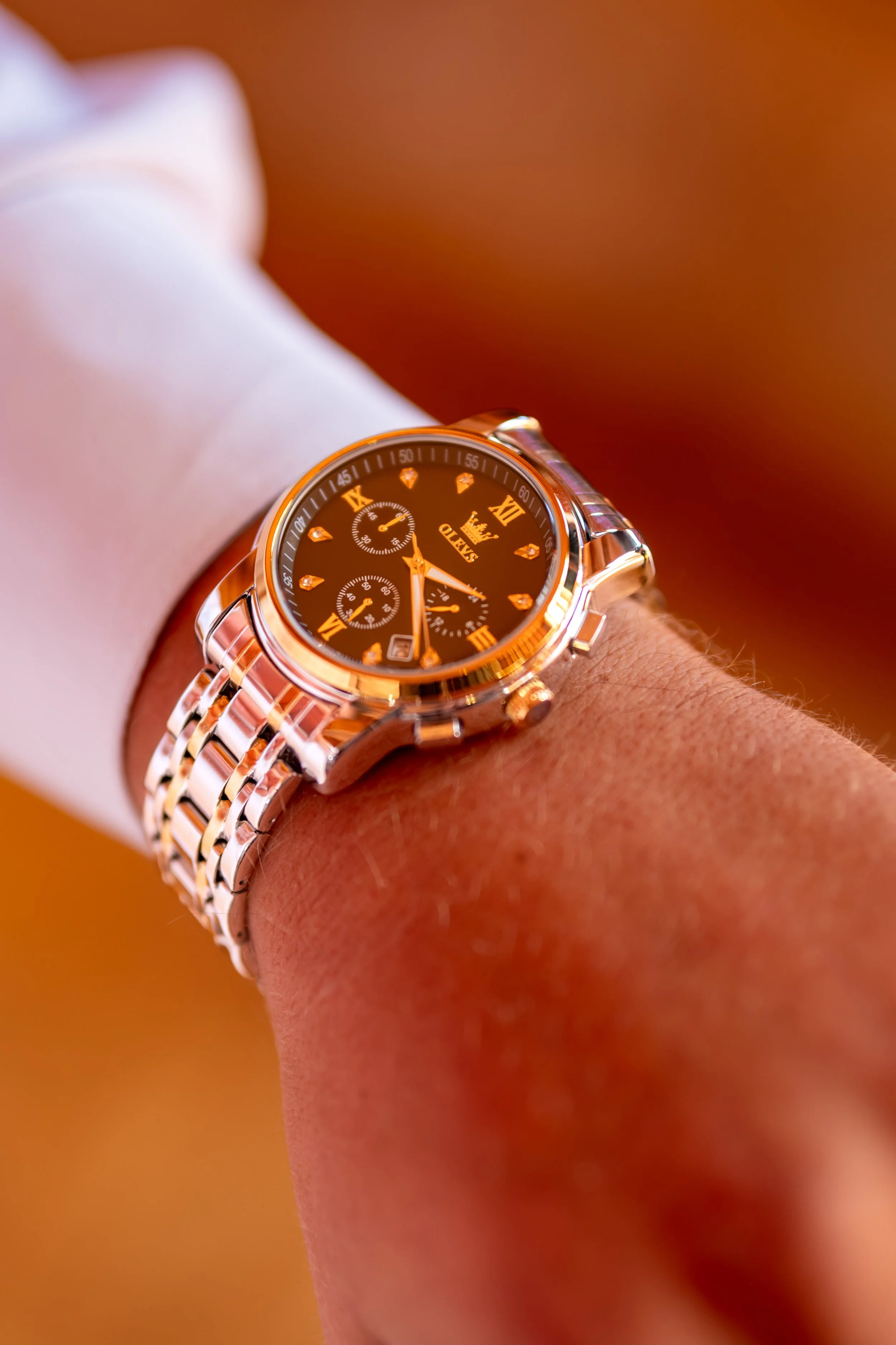 Close detail of Andrew's watch against his white shirt cuff at the Maine Wedding Barn and Event Center in Minot Maine fall wedding photography VMG Productions