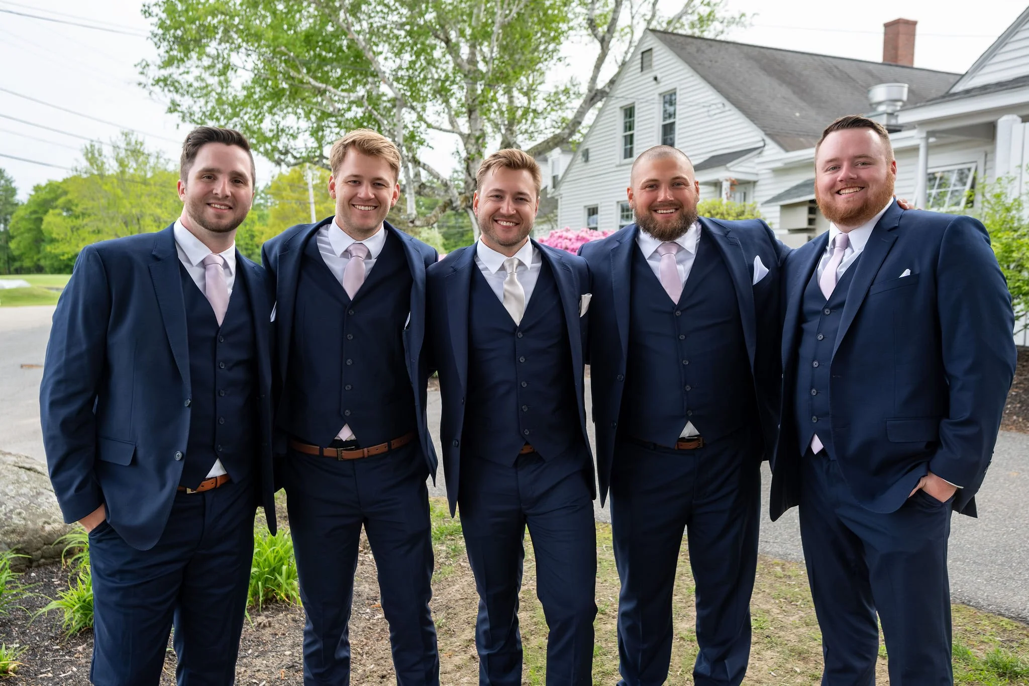 Beth and Cameron groom with his groomsmen in navy suits at Augusta Country Club Manchester Maine spring wedding photography VMG Productions