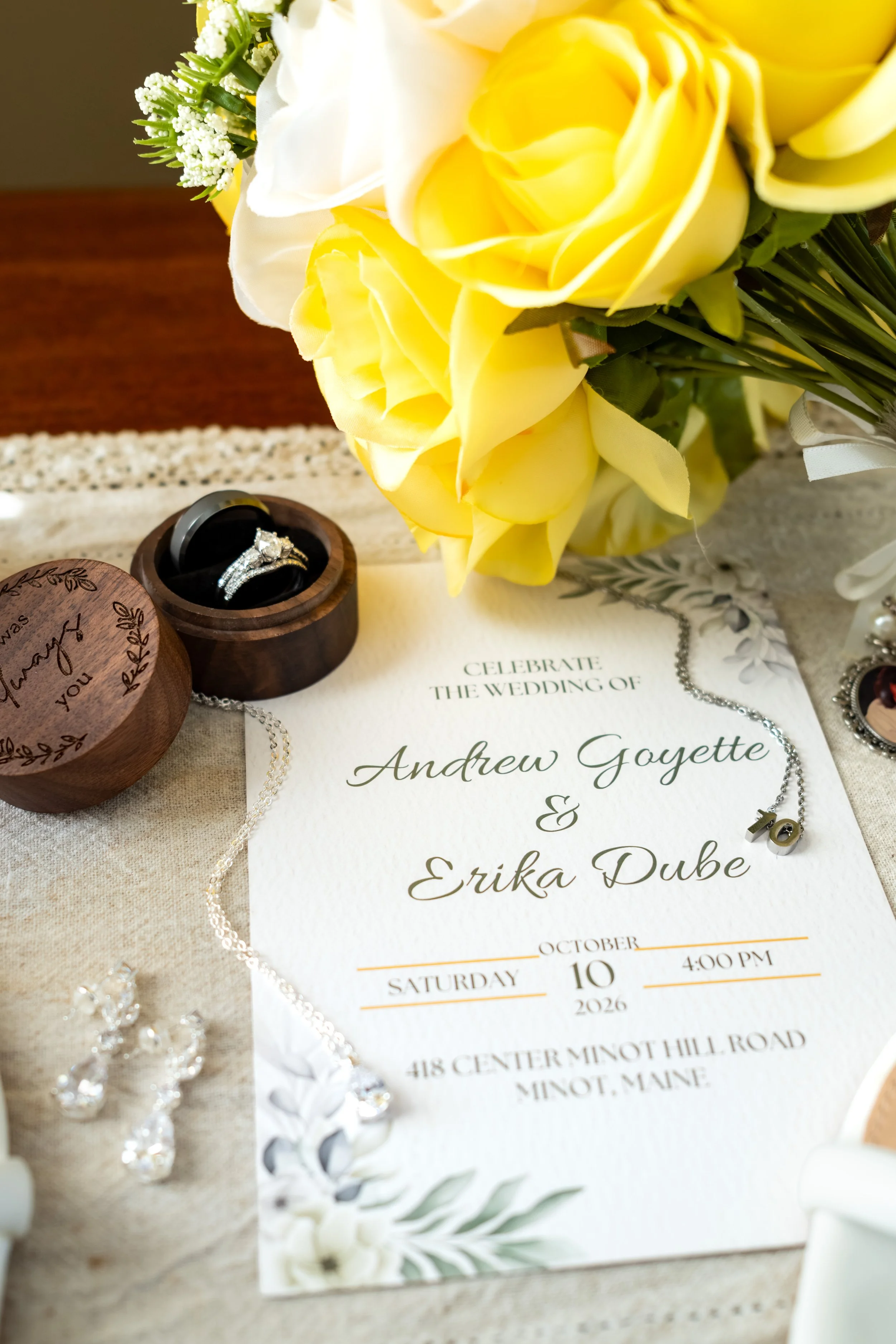 Yellow roses beside an open ring box holding her engagement ring at the Maine Wedding Barn and Event Center in Minot Maine fall wedding photography VMG Productions