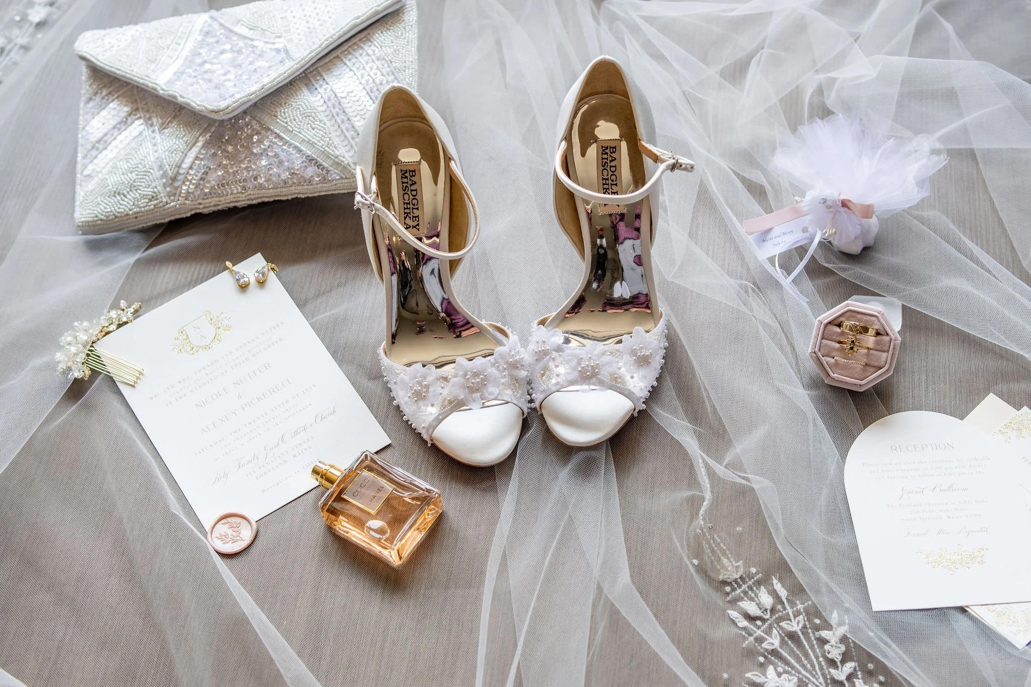 Nicole's wedding details with invitation beaded heels clutch and veil at Portland Sheraton at Sable Oaks South Portland Maine summer wedding photography VMG Productions